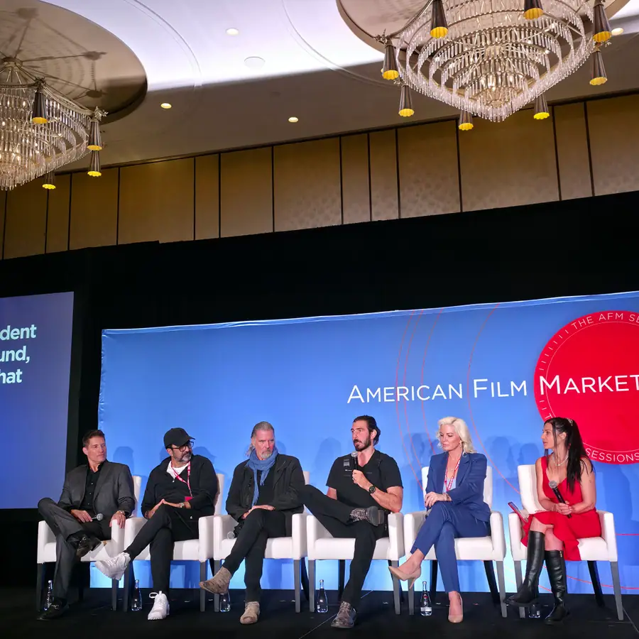 A panel discussion on stage at the American Film Market 2025